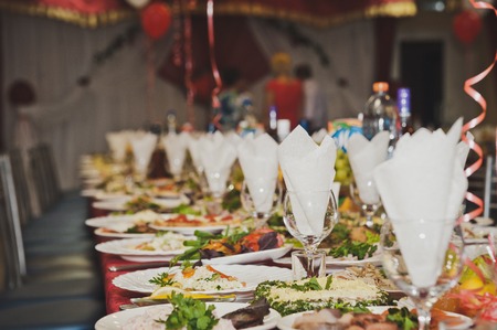 The table is Laden with dishes.
