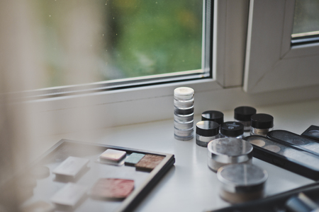 The elements of the makeup on the windowsill.の写真素材