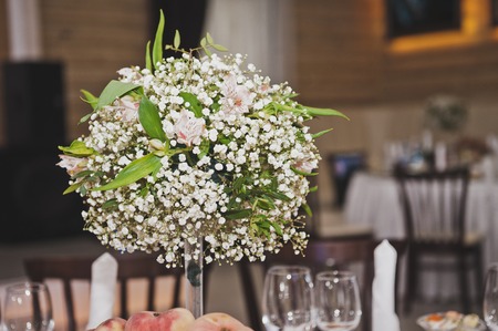 A bouquet of flowers as a table decoration.の写真素材