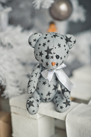 Silver Christmas tree decorated with balls and figurines.の写真素材