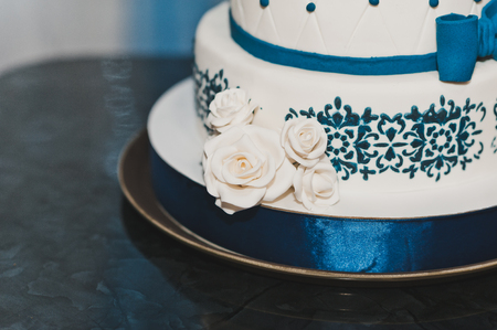 Cake with dark blue patterns and roses.の写真素材