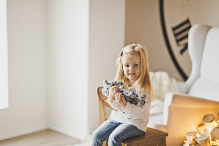 Girl sitting in front of the window.の写真素材