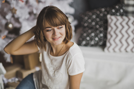 Girl straightens her hair with a hand.の写真素材