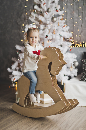 Portrait of baby in Christmas decorations.の写真素材