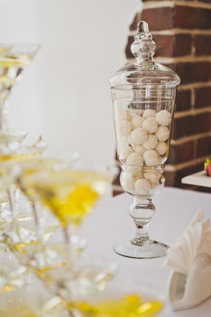 Long visa with round candies on the table.の写真素材