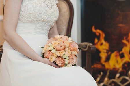 Bouquet of flowers in delicate shades in the womens hands.の写真素材