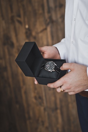 A man holds his box of watches.の写真素材