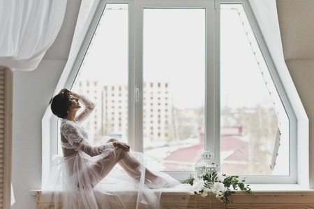 Portrait of a girl in gentle tones in the Studio.の写真素材