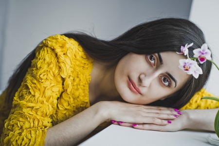 Girl lying on the windowsill.の写真素材
