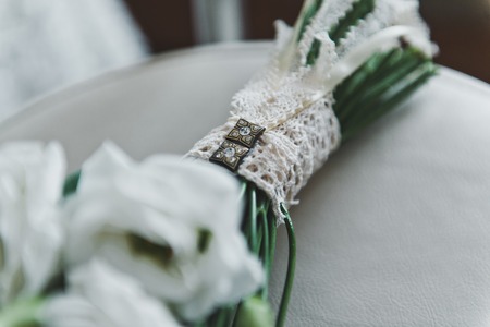 A bouquet of flowers on the chair.
