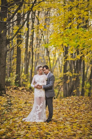 The couple in the autumn forest.の写真素材