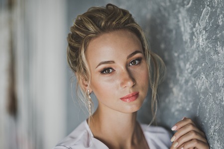 Portrait of young beautiful girl in a negligee.の写真素材