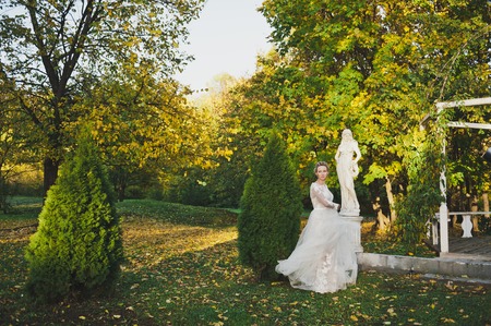 Portrait of a swiftly running bride with developing a dress.の写真素材