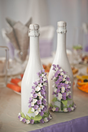 Traditional decorated with the bride bottle of champagne.の写真素材