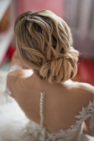 An unusual wedding bun on the brides head.