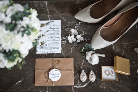 Wedding bouquet and shoes of the bride before the wedding.
