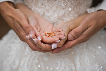 Hugs of newlyweds with wedding rings.の写真素材