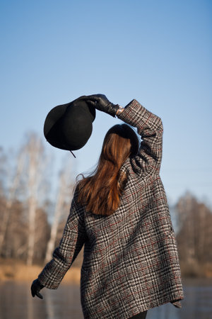 A joyful girl is waiting for the spring wonders of nature.の写真素材