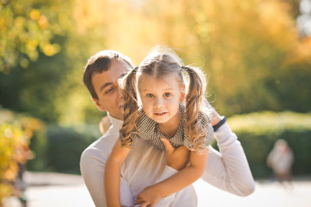 Dad throws up his daughter.の写真素材