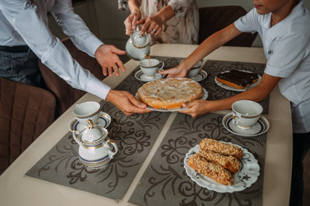 The food in the family circle is prepared by everyone together.の写真素材