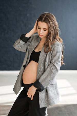 A pregnant girl with a bare big belly.の写真素材