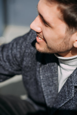 He is indoors and the focus is on his facial features including his beard, moustache, and skin.の写真素材