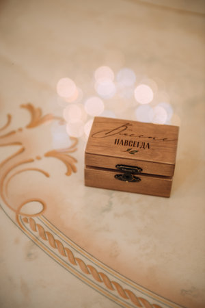 The box is tan/beige in color and appears to be indoors.