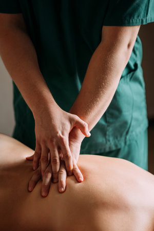 The image shows a womans legs and feet in an indoor setting, possibly during a massage.
