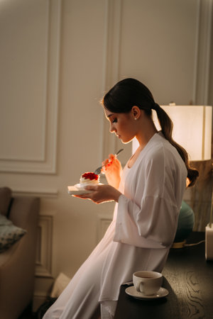 The scene includes a wall, furniture, and the persons face.の写真素材