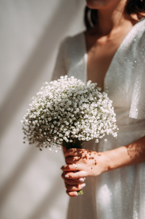 It includes tags such as person, bride, wedding dress, flowers, bridal clothing, and marriage.の写真素材