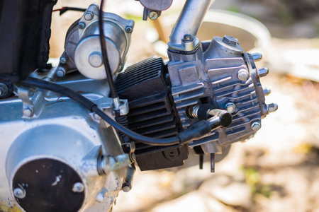 Close-up shot of a motorcycle engine, displaying its intricate mechanical components and design with...