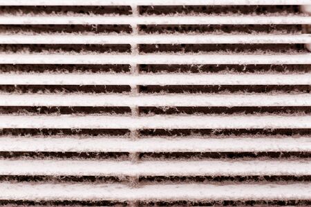 A layer of dust on the ventilation grill in the bathroom. To clean ventilation at home.