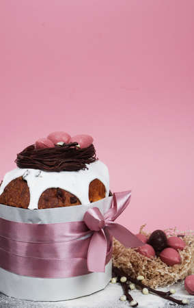 Composition of chocolate figurines. Chocolate bunny. Chocolate eggs on a colored background. Place...