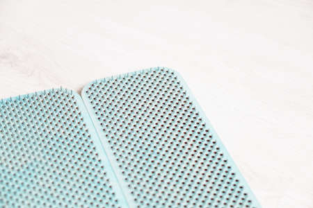 Blue sadhu board made of wood with nails. A man stands on nails. View from above.の写真素材