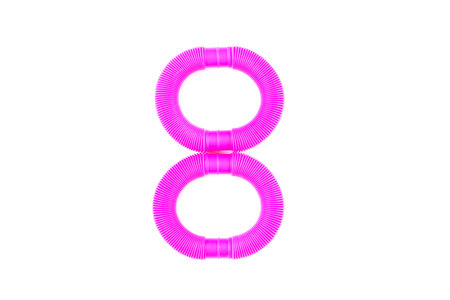 International Women's Day 8 March. pop tube trending toy of 2021.anti-stress sensory plastic toy from a tube of pink and blue color on an isolated white background. Digit 8. Flat layout with space for text.の写真素材