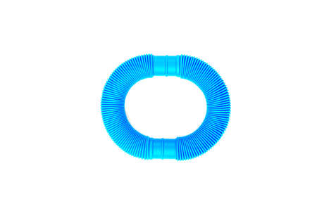 Smile from plastic corrugated tube, pop tube. trending toy of 2021.anti-stress sensory plastic toy from a tube of pink and blue color on an isolated white background. Flat lay with place for text.の写真素材
