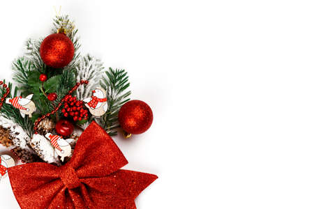 Copy space horizontal greeting card Happy New Year and Merry Christmas on isolated white background. White background for text with Christmas decorations, fir branch, New Year's bouquet and bokeh of golden color. 2022. Text with congratulationsの写真素材