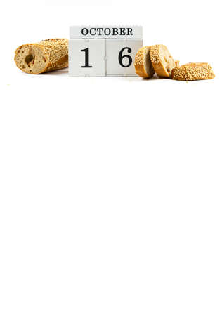 Bread Day 16 October. The concept of a vertical banner for the holiday. Bread concept on isolated background.の写真素材