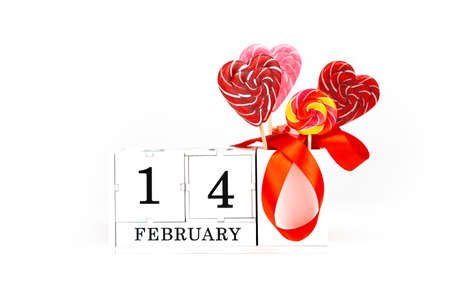 Valentines day on an isolated white background. Calendar cube with the date and month of the...