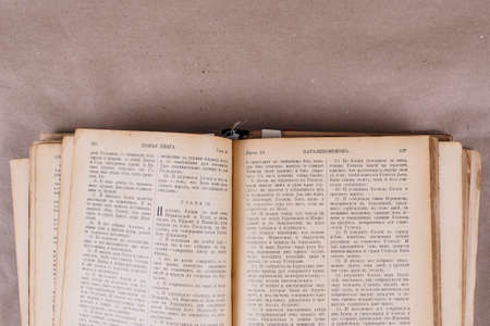 Old Slavonic bible on an isolated white background. Ancient big book. The Bible is written in Old Russian. Old book. antiquesの写真素材