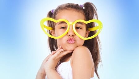 Funny little girl, studio shotの写真素材