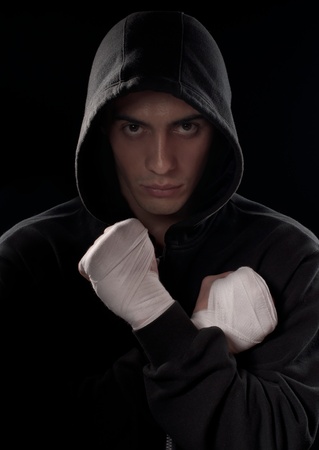 Fighter getting ready for figh, isolated on blackの写真素材