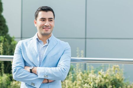 Portrait of gorgeous young man. Happy turkish man, outdoor - outside