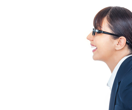 Profile of happy smiling young businesswoman with spectacles talking something, isolated on whiteの写真素材