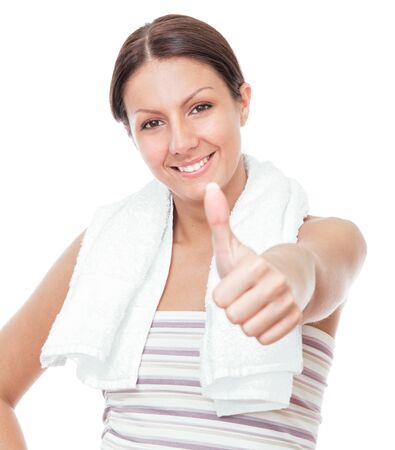 Smile beauty woman gesturing thumb up, close-up fitness female, isolated on white backgroundの写真素材
