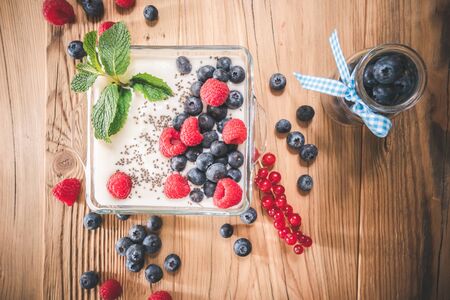 Yogurt with berries and chia seeds. Healthy meal. Top viewの写真素材