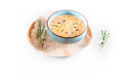 Mushroom cream soup isolated on white background. Served healthy food or lunch with champignons. Top viewの写真素材