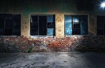 Old cracked or grungy wall and windows at background, night shotCopy space - copyspace