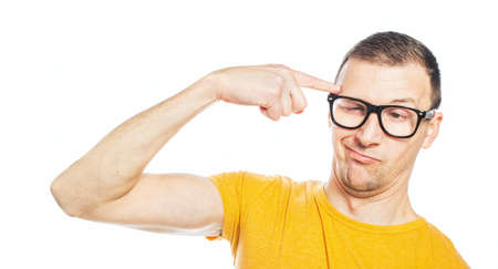 Silly man make a funny facial expression. Guy with cross-eyed isolated on white. Close-upの写真素材