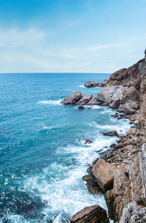 Surf off the coast. Swelling. Ocean and rock - mountains. Copay space - copyspace. Summer concept. Nature backgroundの写真素材